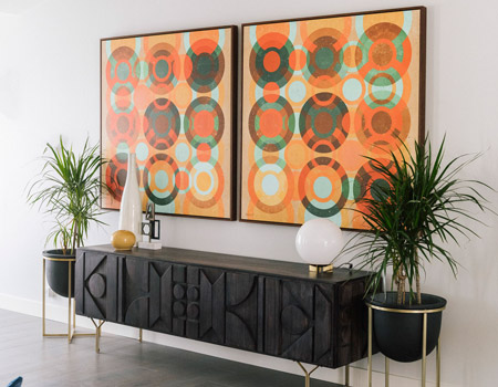 Let your artwork define the space. Hanging art on the walls creates a dynamic space, and art is a reflection of your style and personality.