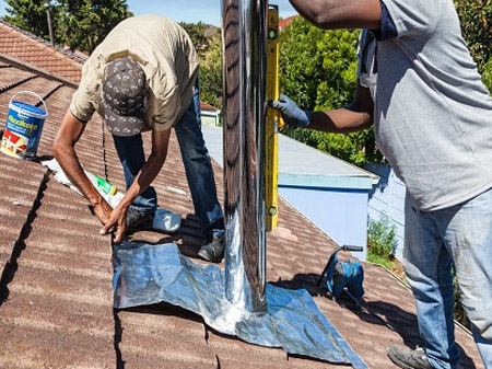 Install the cut roof tiles and flashing