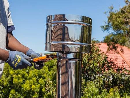 secure the cap on the top of the flue assembly