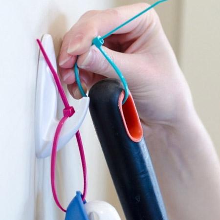 need to hang items ecure a zip tie through the hole