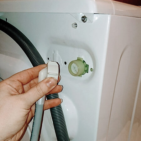 attach hose to back of washing machine