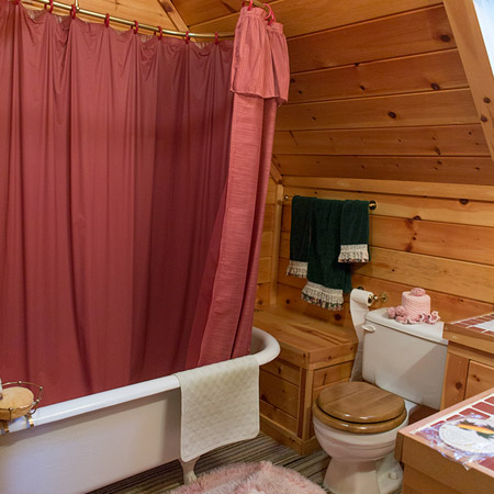 upstairs bathroom once again has wood panelled walls
