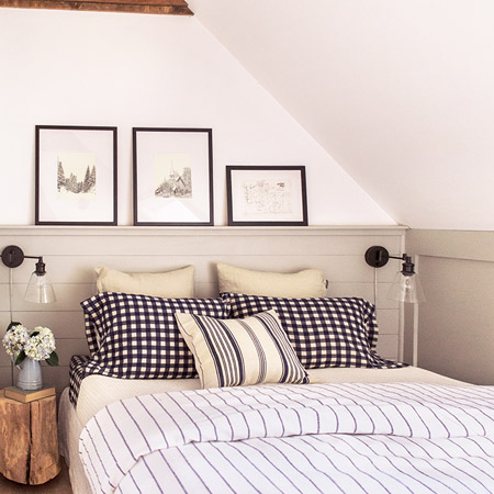 Panelling was added around the bed head to balance out the panels on the side wall