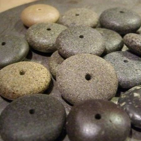 drill holes in river pebbles