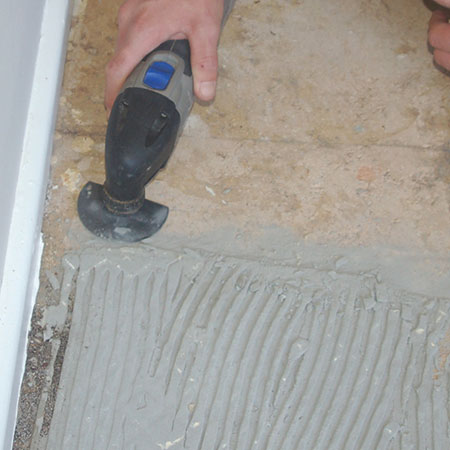 tiling tips - remove stubborn tile adhesive with multifunction tool