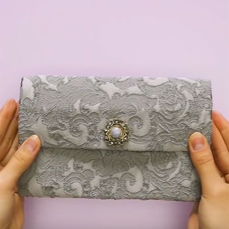 Make a designer clutch from recycled materials