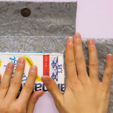 Make a designer clutch from recycled materials