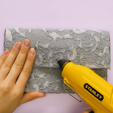 Make a designer clutch from recycled materials
