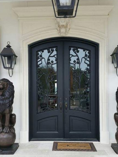 front door with decorative wrought iron detail