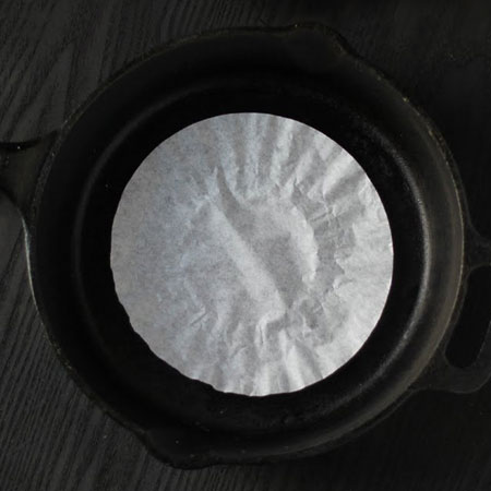protect cast iron pans with coffee filter