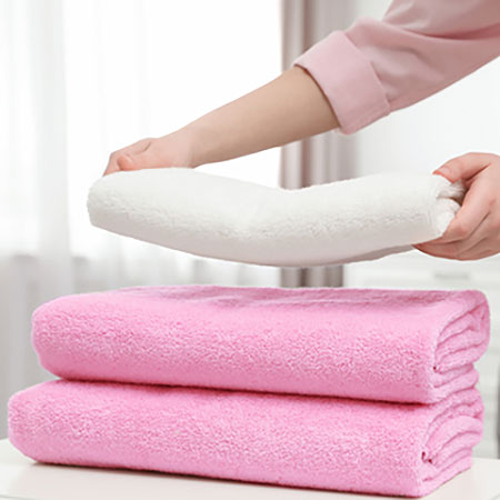 fluff up your towels in a tumble dryer
