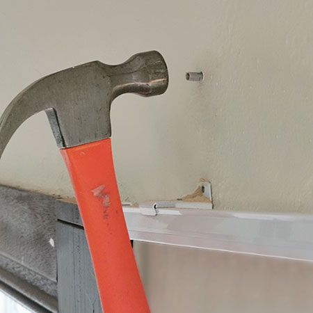 tap wall plug firmly into drilled hole