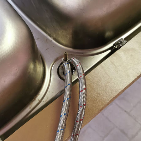 mount new kitchen taps to sink unit