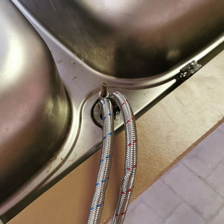 mount new kitchen taps to sink unit