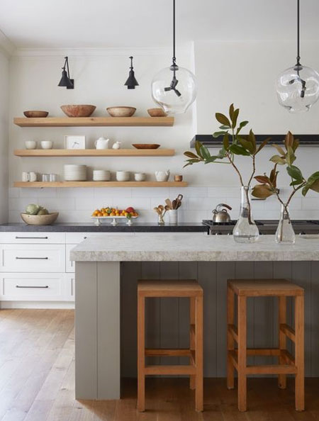 wood shelves in white tiled kitchen