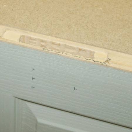 mark the location for  the door handle and keyhole