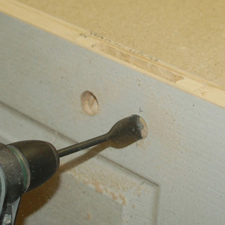 use spade bit to drill holes for door handle spindle and keyhole