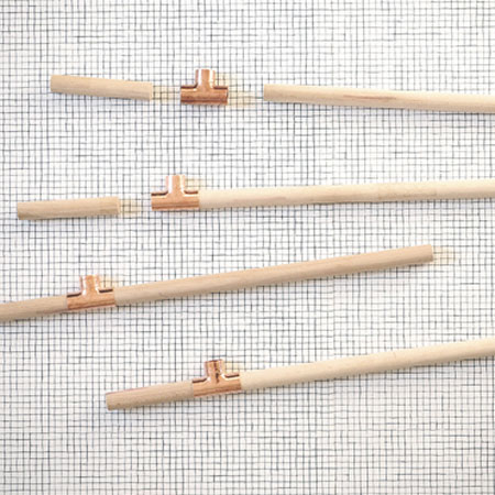 easy plant stands made using pine dowels and copper fittings