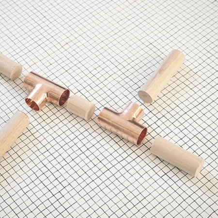 easy plant stands made using pine dowels and copper fittings