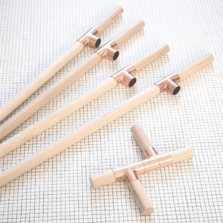 easy plant stands made using pine dowels and copper fittings