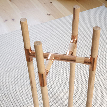 easy plant stands made using pine dowels and copper fittings