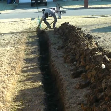 dig trench to drain water away from property
