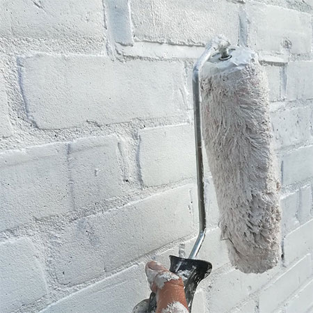 apply primer to raw brick, plaster or dry wall
