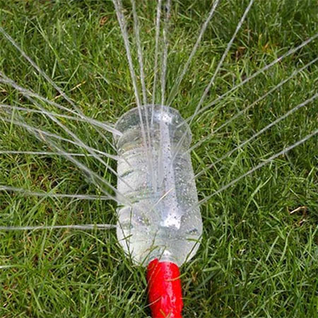 water lawn with plastic bottle sprinkler
