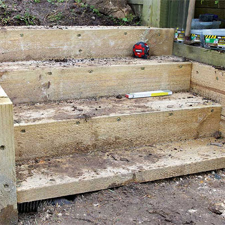 steps for levelled out garden with retaining wall