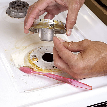 clean clogged burner on gas hob or stove top