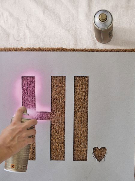 spray paint personal message onto door mat