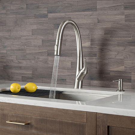Why do people choose single handle faucets for their kitchens?