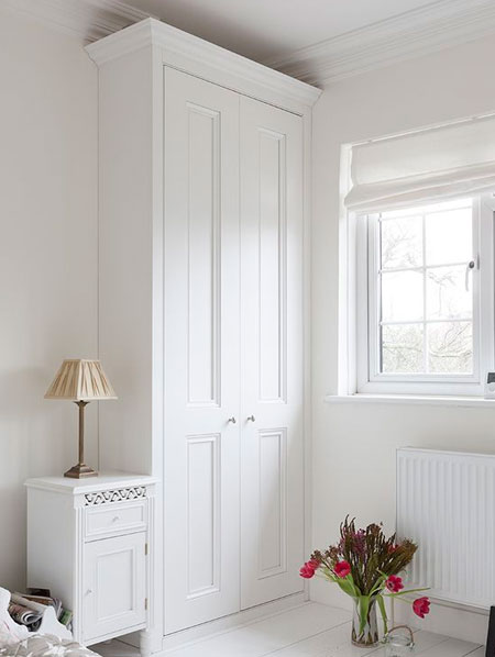 narrow built in cupboard for clothes