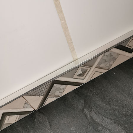 finish off edge of tiles with edging strip