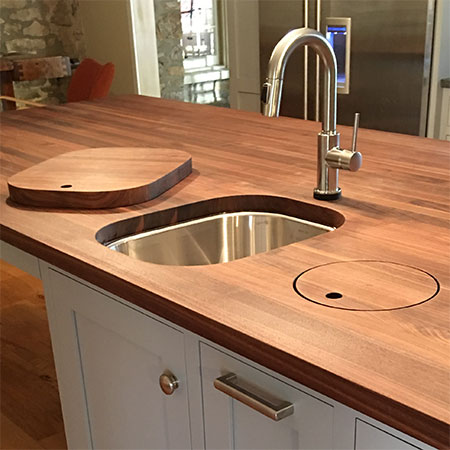timbershelf will do cut outs for you in laminate countertops