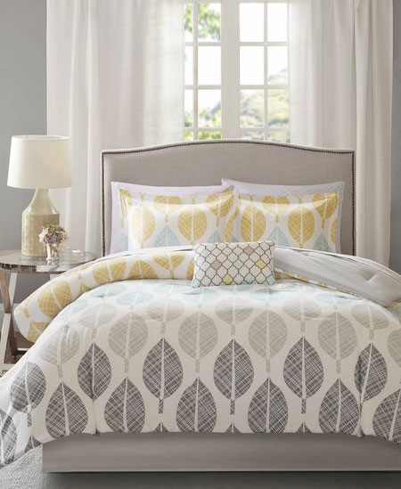 bed in front of window guest room