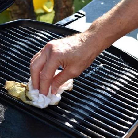 clean grill with newspaper or paper towel