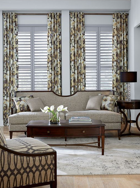 layer window treatment with curtains or drapes and shutter blinds