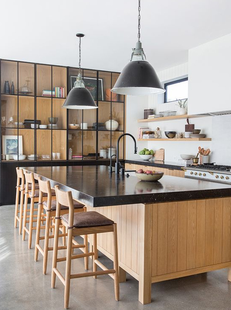 wood kitchen with black countertops