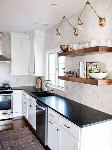 white kitchen with black countertops