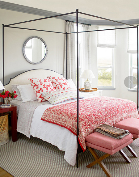 4-post bed in room with low ceiling