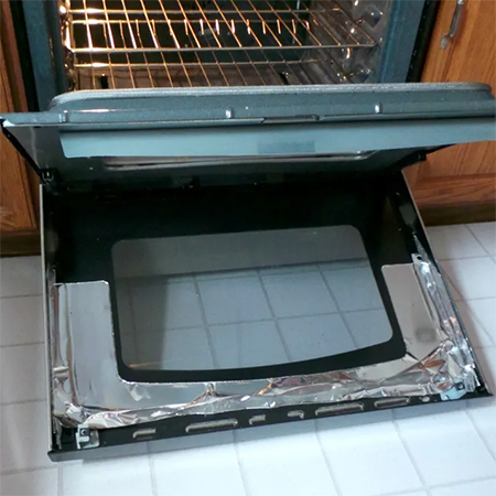 how to clean inside oven door