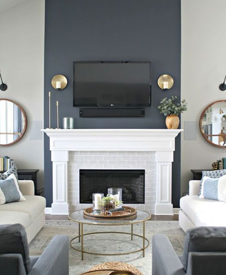 darker paint above fireplace hides smoke stains