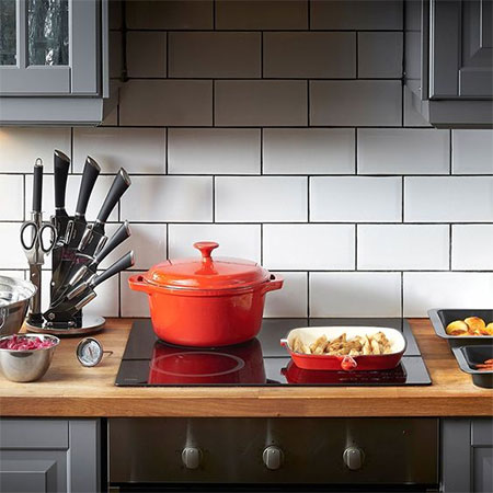 colourful pots and pans in rental kitchen