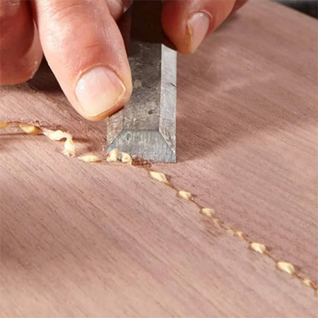 Use a sharp wood chisel or utility knife to clean away partially dried glue.