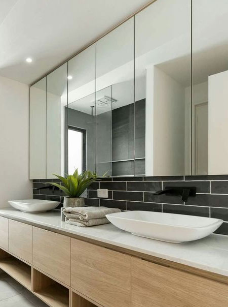 large mirrors bring light into bathroom