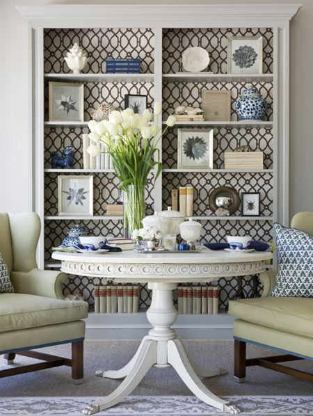 patterned wallpaper on back of bookcase or bookshelf