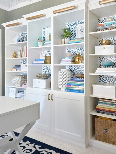 playful patterned wallpaper on back of display unit