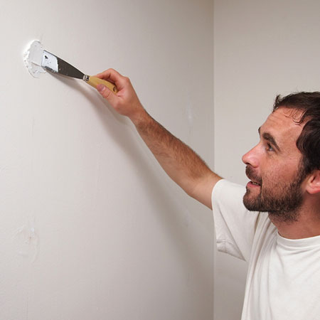how to fix nail holes in walls