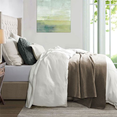 layer the bed with pillows and throws